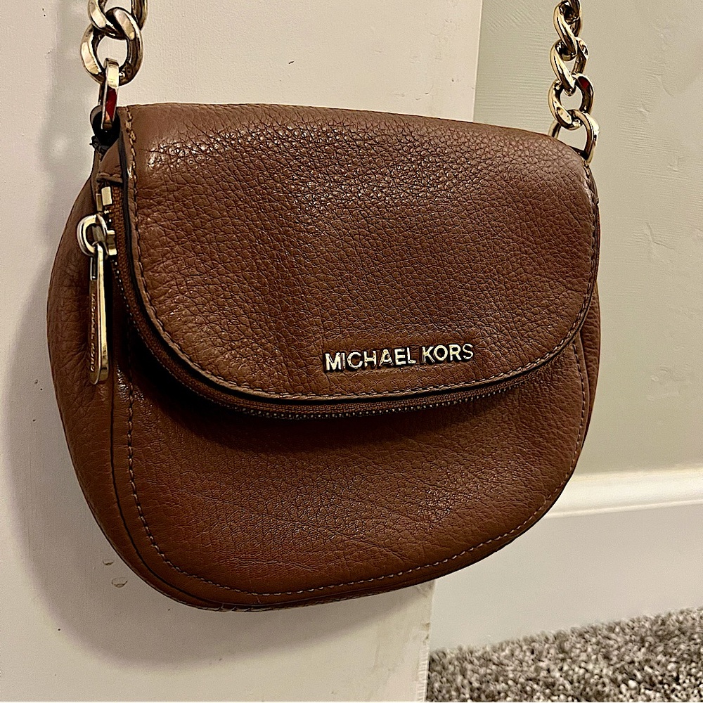 Brown leather crossbody purse.